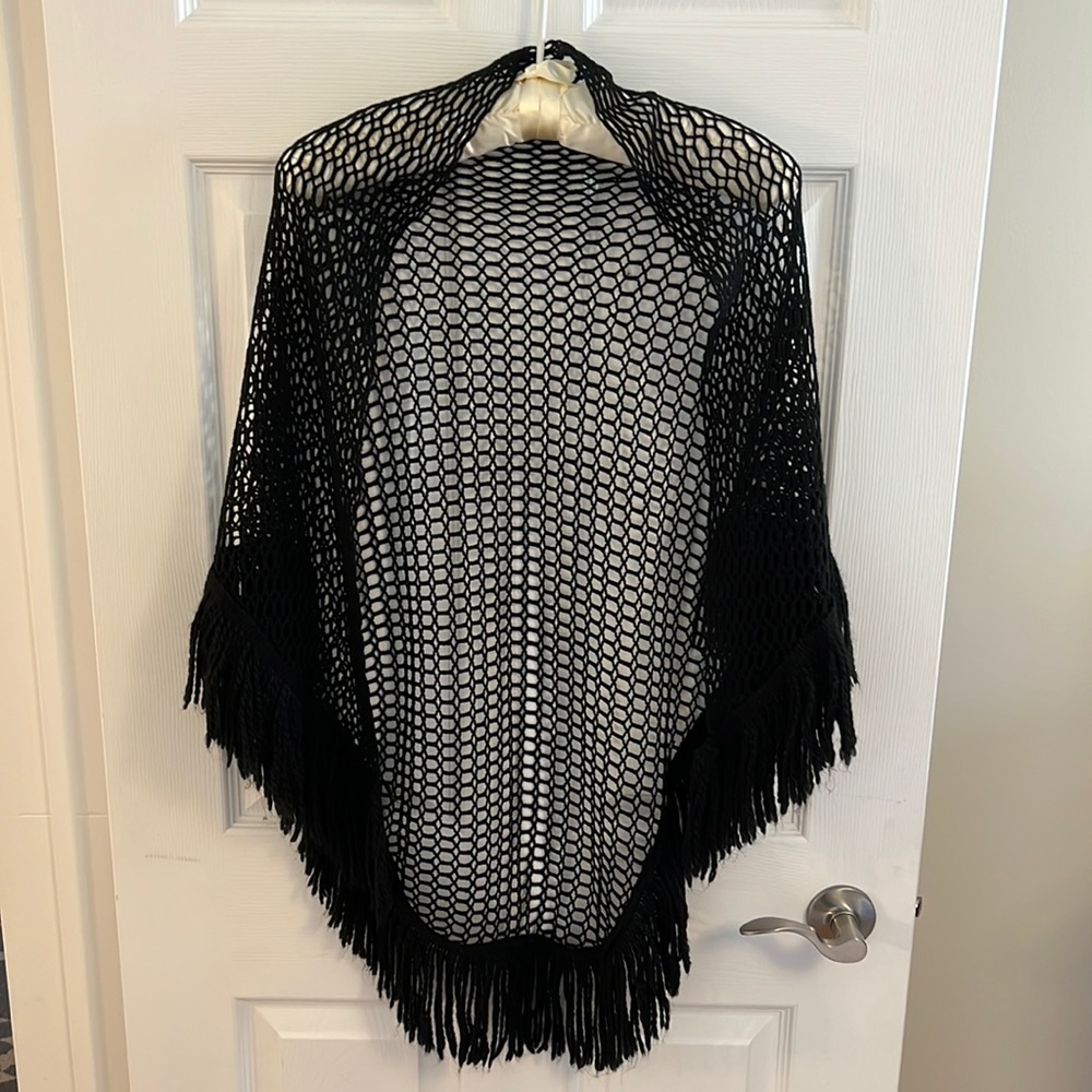 Unbranded airy black crotchet shawl.